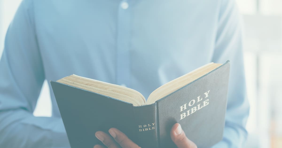 man holding bible